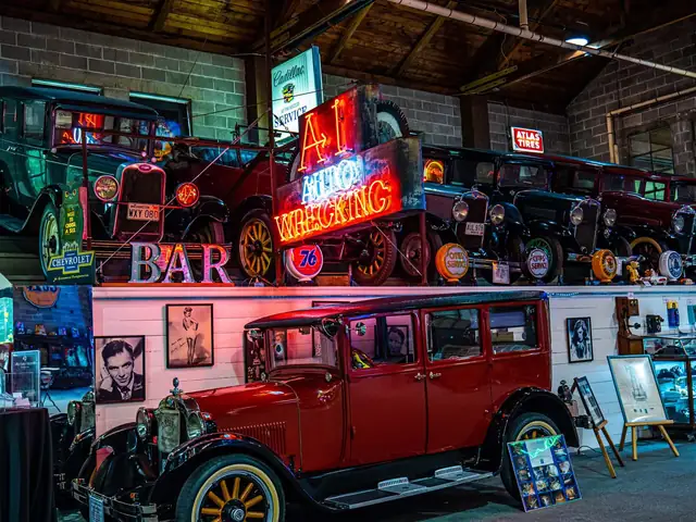 Vintage cars and neon signs on display inside the LeMay Collections at Marymount museum hall
